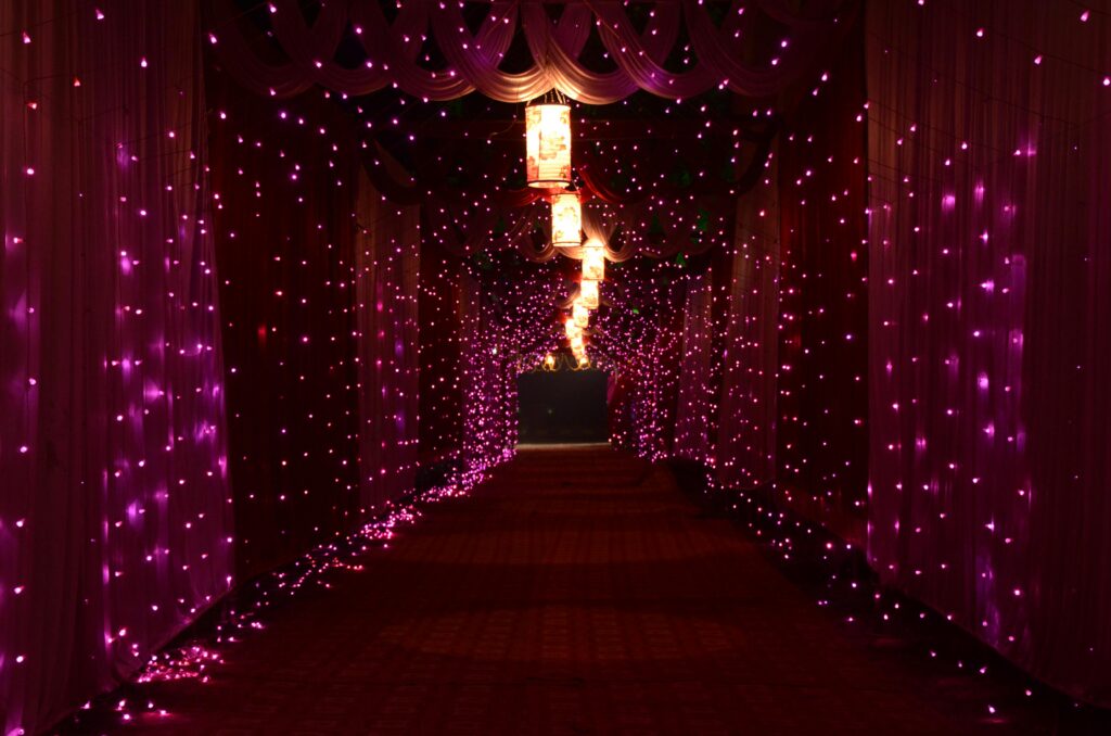 A mesmerizing corridor lit with vibrant purple lights creating a magical ambiance indoors.